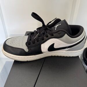 Nike Black and Gray Sneakers with Iconic Design